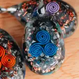 Harmony Amulet – Handcrafted Triskelion Orgonite Pendant - Image 3